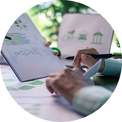 A close up of a man sat at a desk filling in documents.
