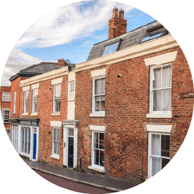 A long shot of brick terraced houses.
