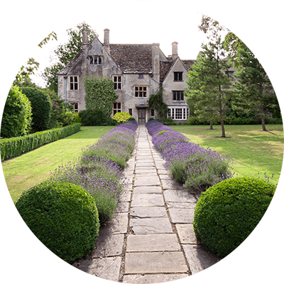 A stone path leading to a stone house.
