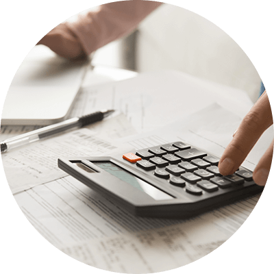 A woman typing into a calculator.