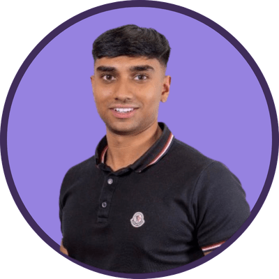 A young Asian man, Adil Hanif, smiling in front of a light purple background.