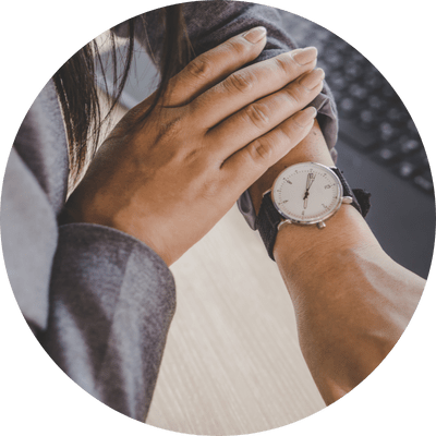 Close up of a female wrist with a watch on it.