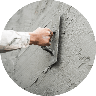 Bio-concrete being skimmed on to a wall.