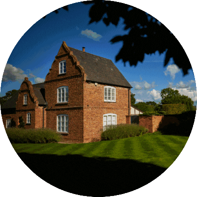 Images of a beautiful old hall and gardens.