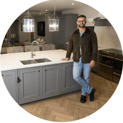 Landlord standing in new kitchen.