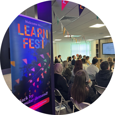 Learnfest 2024 session in front of an audience of Together employees.