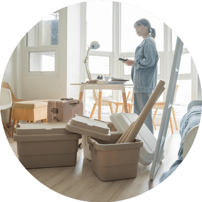 A young women unpacking belongings in smart apartment.
