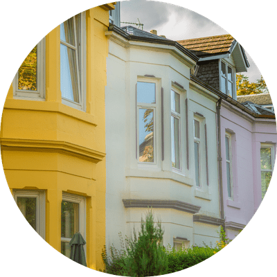 A row of colourful detached homes in Scotland.