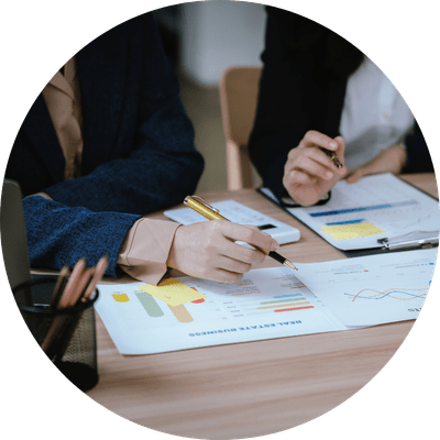 Two landlords reviewing their rental portfolio ahead of refinancing.