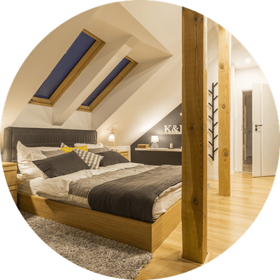 The interior of a high quality loft conversion, transforming the space into a spacious bedroom.