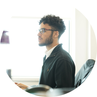 Male sat working at a computer