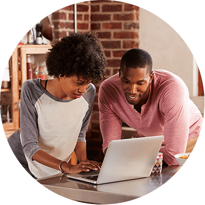 Couple looking at a laptop