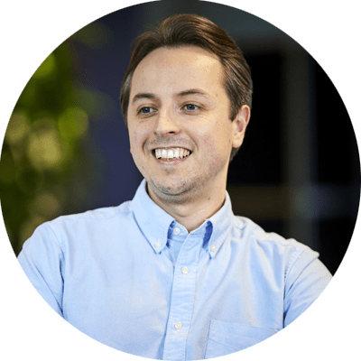 Young professional man smiling just off camera