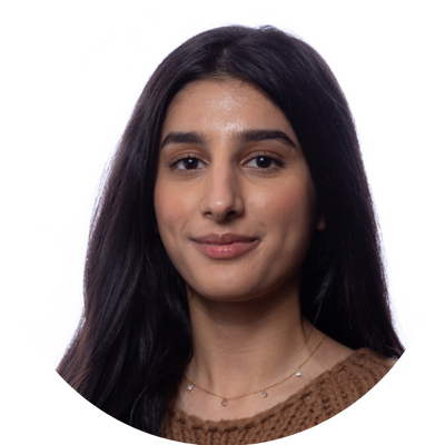 A woman with long black hair smiling.