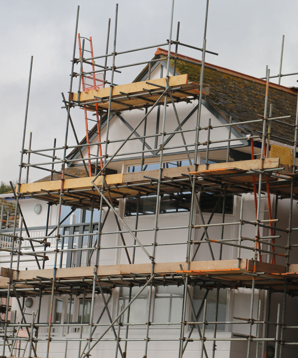 A period property mid-renovation behind scaffolding