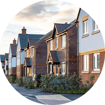 A wide shot of brick terraced houses in a line.