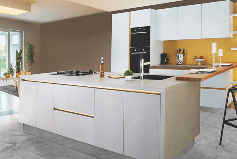 modern white kitchen with large island and yellow walls - l