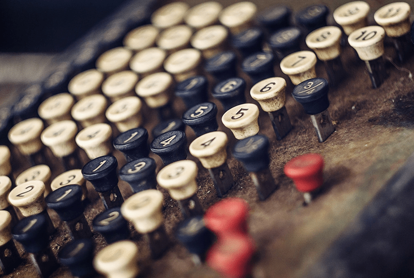 old fashioned calcuylator with black red and white keys - l