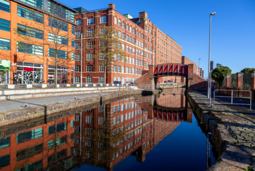 Renovated mill warehouses on the banks of the canal in Ancoats, Manchester, including office space, retail, hospitality and mixed-use properties.