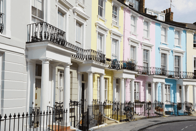 row of pastel coloured houses in a crescent - l