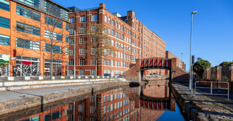 Renovated mill warehouses on the banks of the canal in Ancoats, Manchester, including office space, retail, hospitality and mixed-use properties.