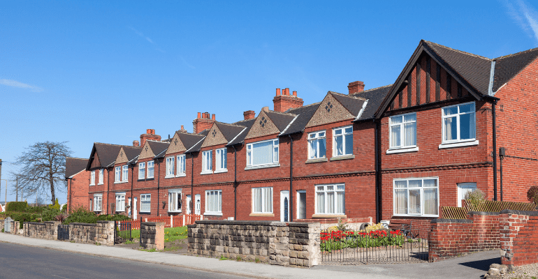 Row of english red brick terraced houses.