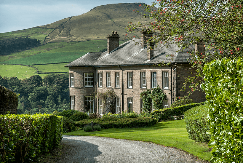 A stone mansion in the countryside.
