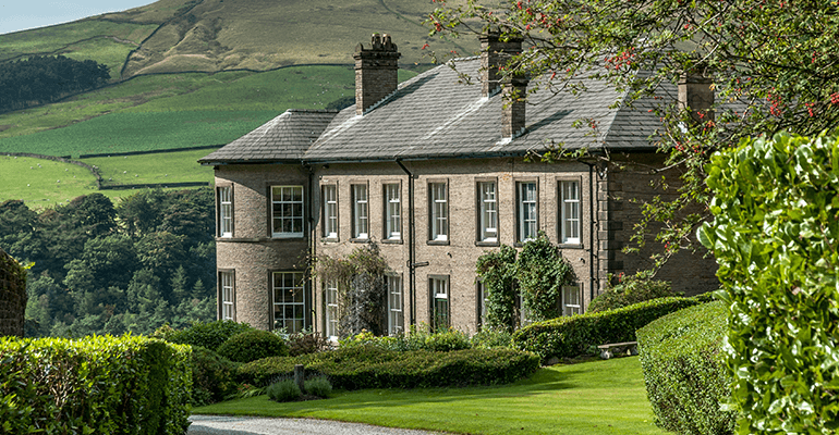 A stone mansion in the countryside.