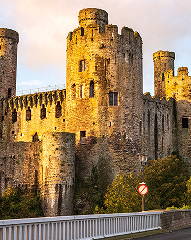 Conwy castle pictured with a bridge in foreground.