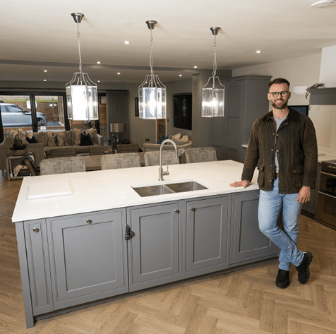 Darryl Cullerton leaning against a kitchen island.