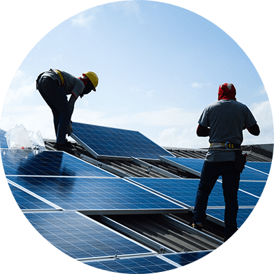 Two construction workers fitting solar panels on a roof - 50