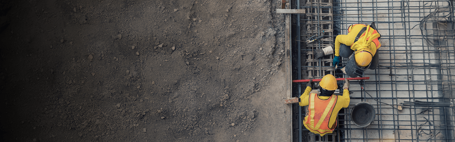 A birds eye view of two builders working outside.