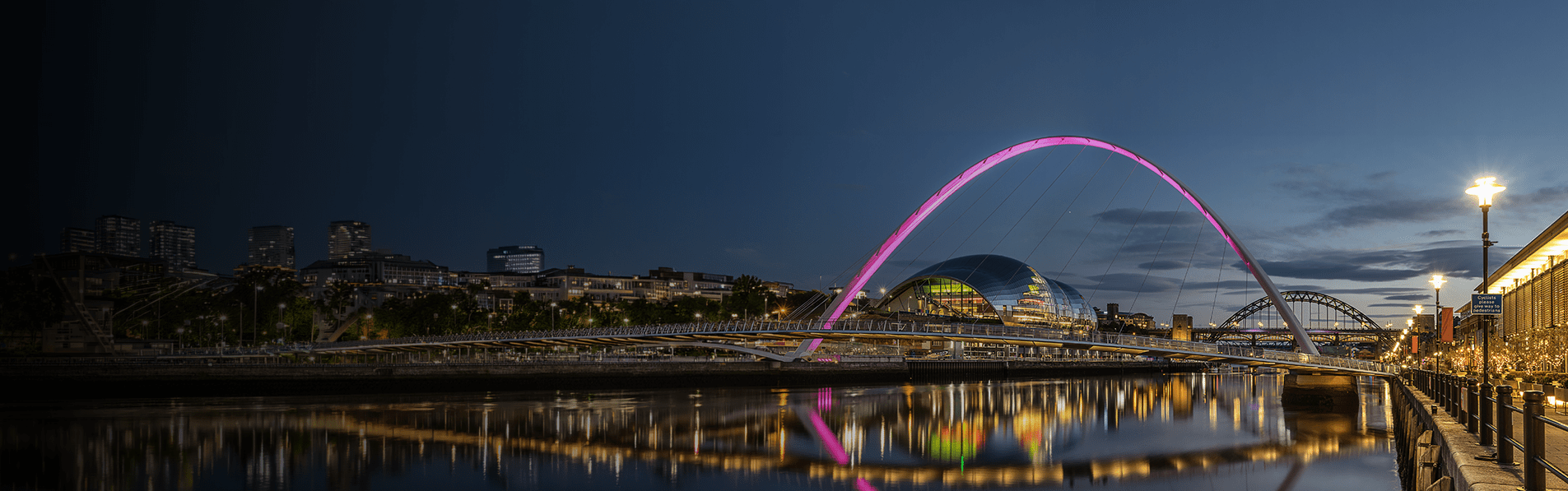 A wide shot looking across the River Tyne on the Quayside of Newcastle.