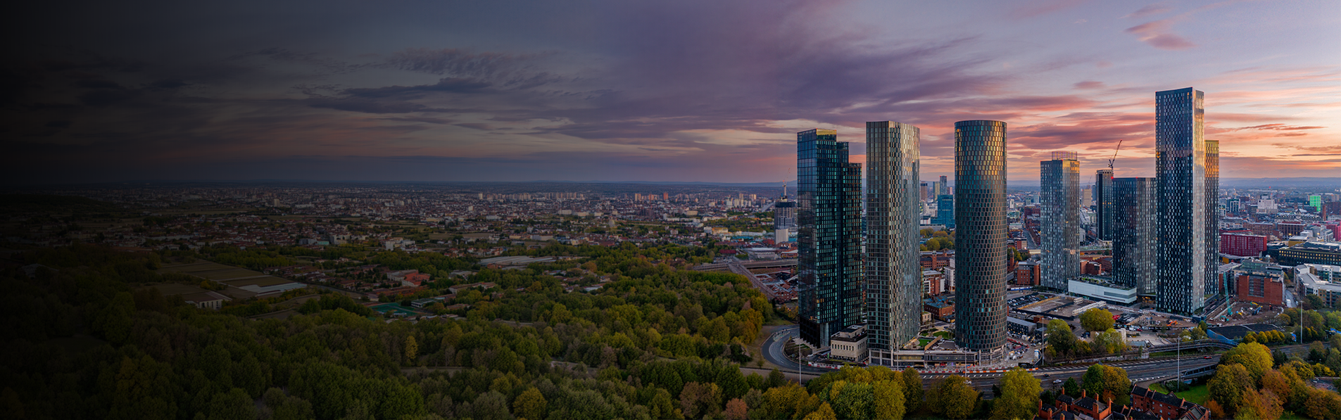 A wide shot of Manchester City Centre at dawn.