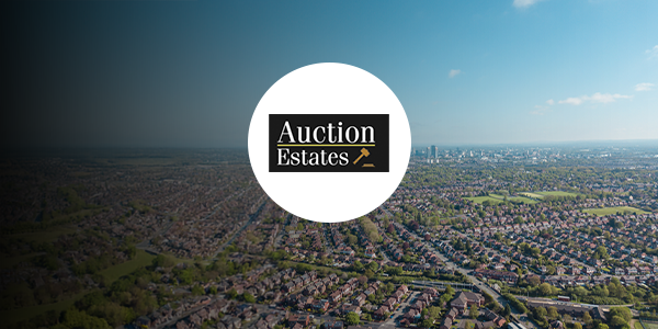 A birds eye view of Manchester with an Auction Estates logo over it.