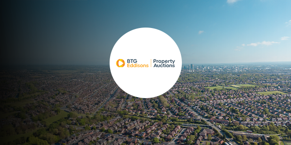 A birds eye view of Manchester with a BTG Eddisons Property Auctions logo over it.
