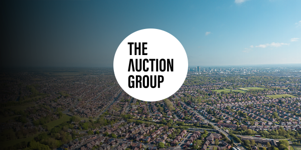 A birds eye view of Manchester with The Auction Group's logo over it.