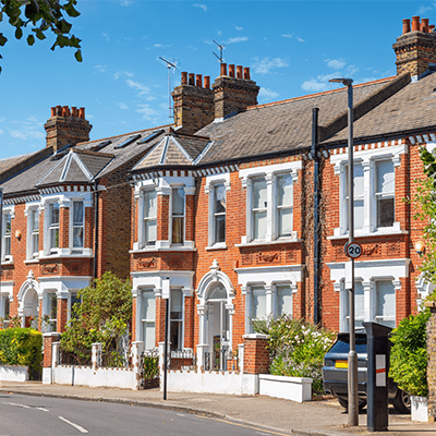 A wide shot of terraced houses on a street.