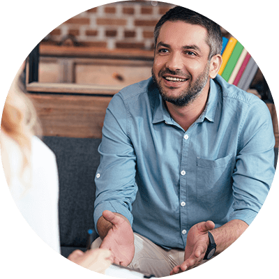 A close up of a man talking.