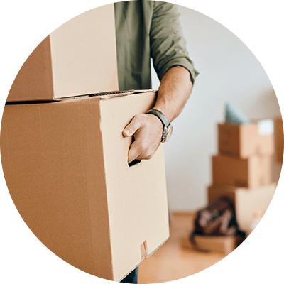 A close up of someone carrying boxes.