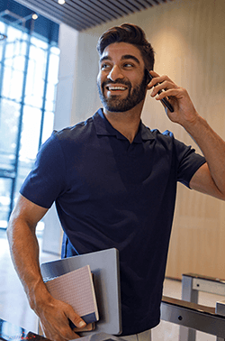 A happy man on the phone.