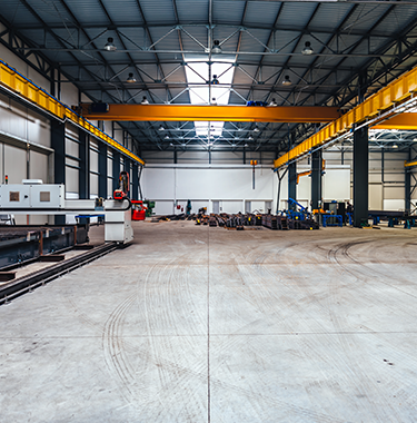 A wide shot of the inside of a modern warehouse.